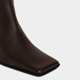 ALAÏA 拼接質感方頭及膝長靴